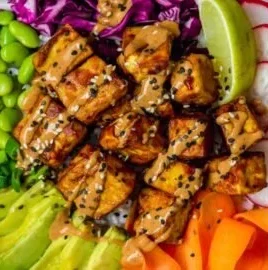 Tofu Buddha Bowl with Peanut Sauce and colorful vegetables