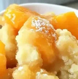 Delicious Peach Cobbler Dump Cake served in a dish.