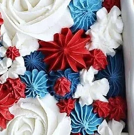 Red White and Blue Frosted Vanilla Cake decorated for a festive celebration.