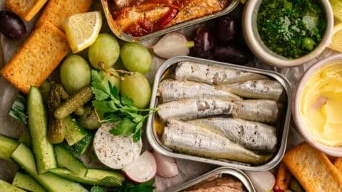 Colorful Spring Tinned Fish Board showcasing various tinned fish delicacies.